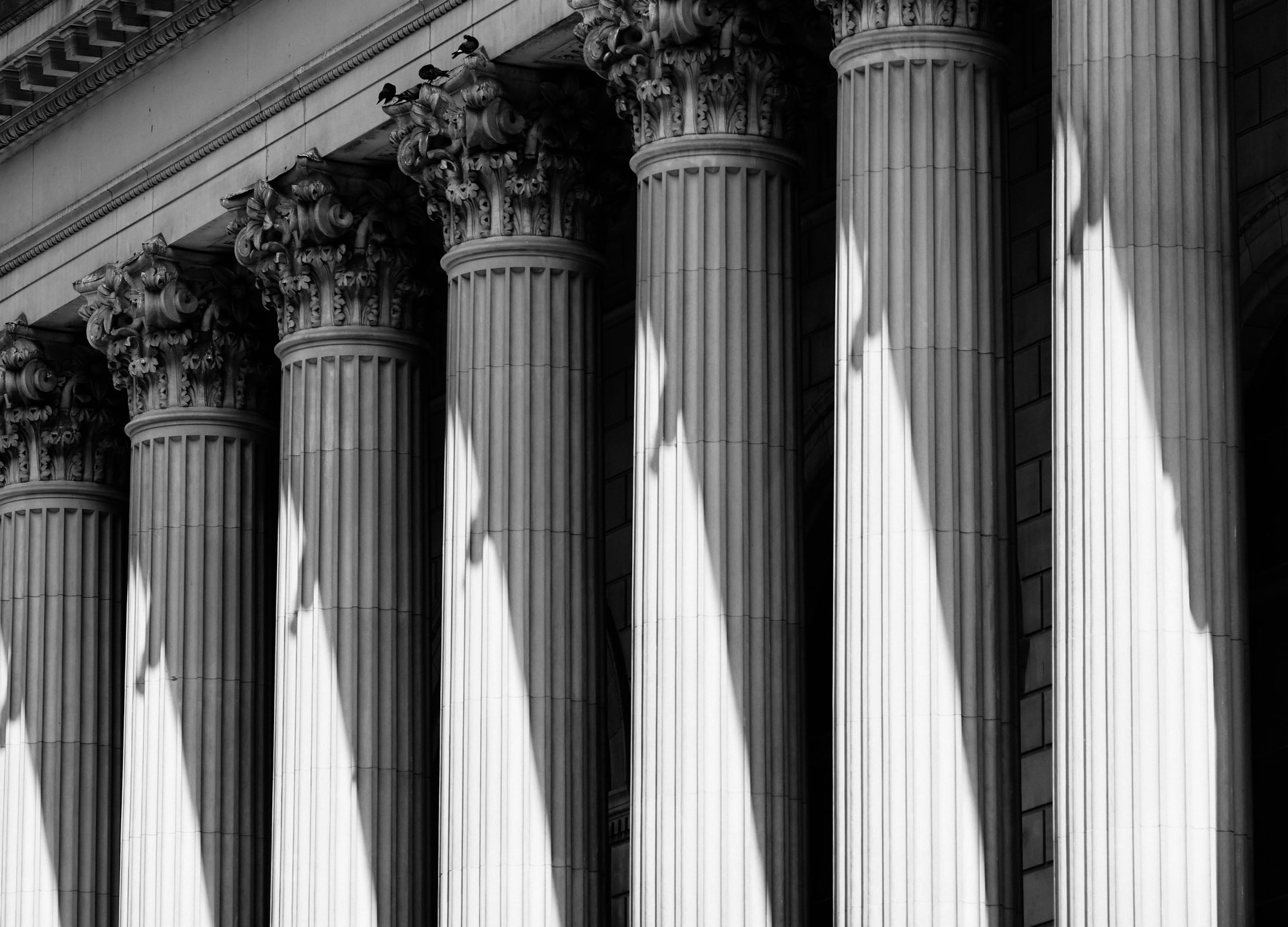 Monumental stone columns in light and shadow